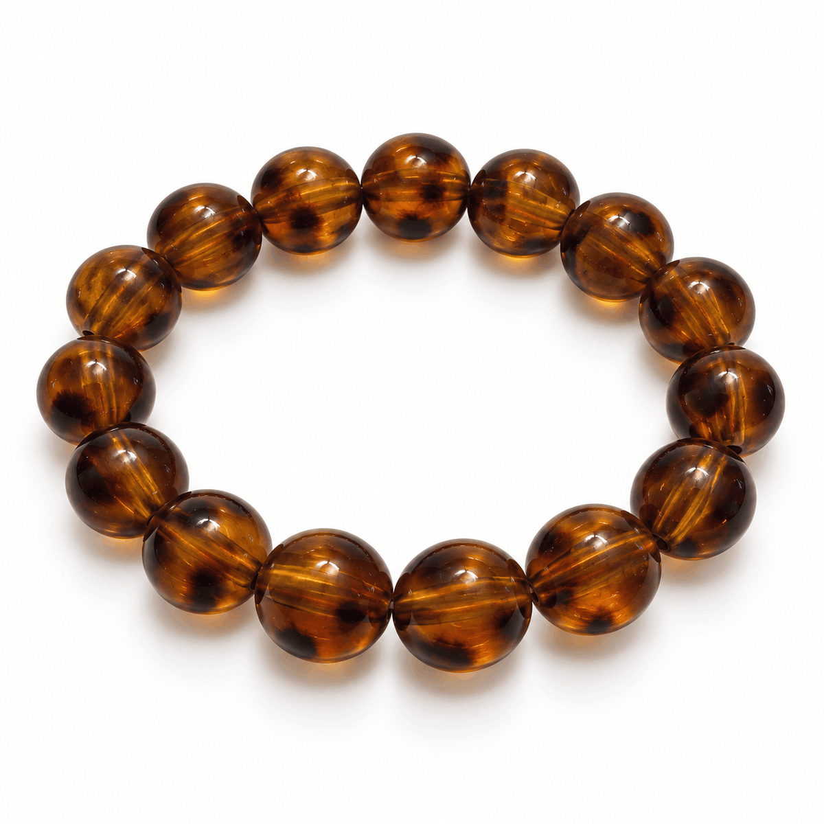 Bruine Amber kralenarmband met warme tinten en goudkleurige details van Hippe Kraal