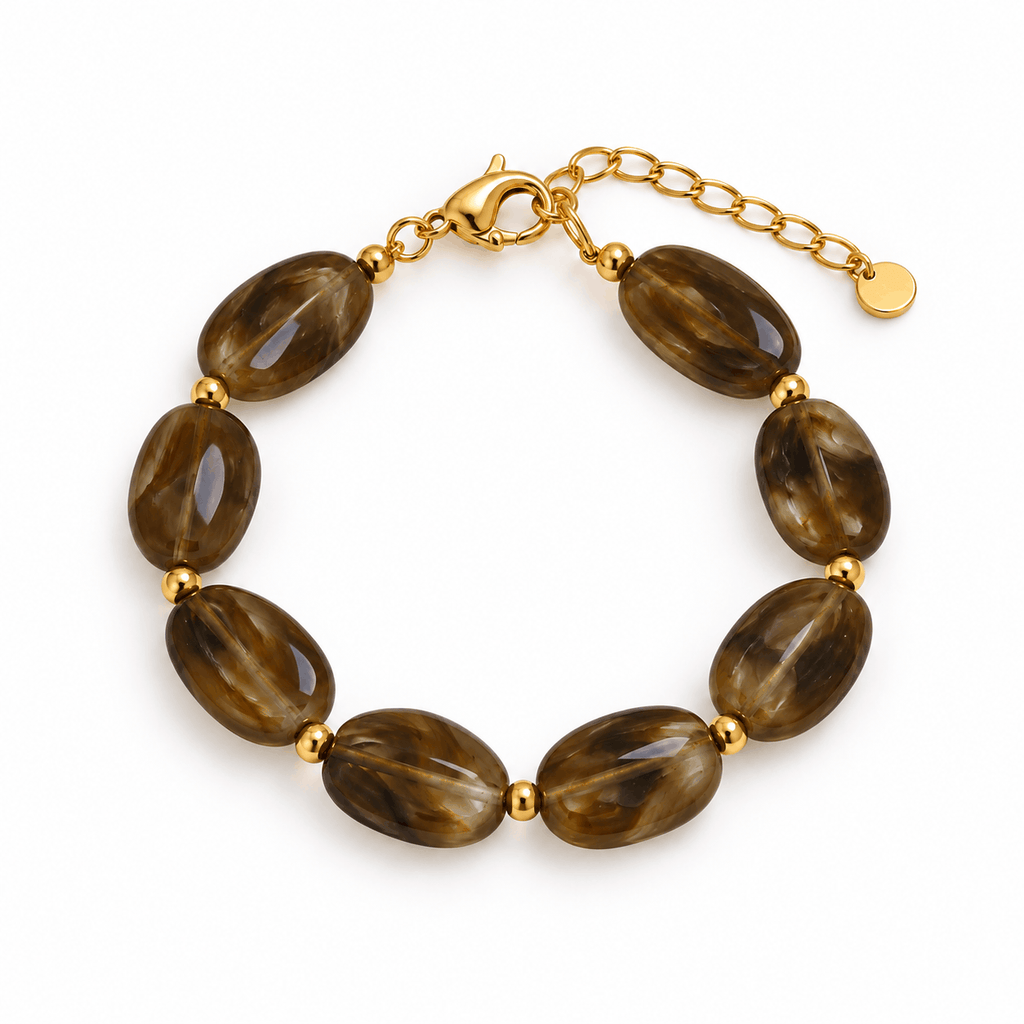 Bruine kralenarmband met goudkleurige details van Hippe Kraal